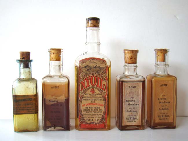 A RARE original Whale Oil display case for NYOIL containing 5 bottles circa 1890-1900 — image 2